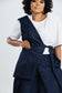 Off Cut Denim asymmetric top showing the one-shoulder panel and wrap front