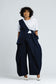 Off Cut Denim top styled with wide-leg denim trousers, full-length front view