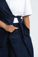 Close-up of the waist tie and angled front on the Off Cut Denim top